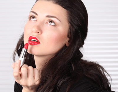 Woman Applying Makeup in the Workplace