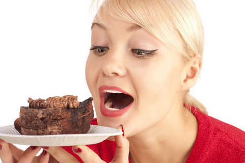 Woman Eating a Cake