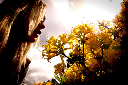 Girl Smells the Flowers