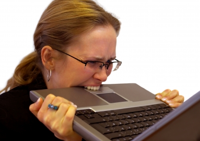 Stressed Woman Chewing Her Laptop