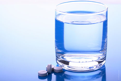 Pills and a glass of water