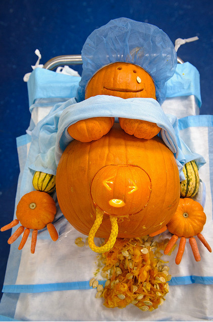 pumpkin-mum-giving-birth-non-identical-twins-and-midwife-halloween