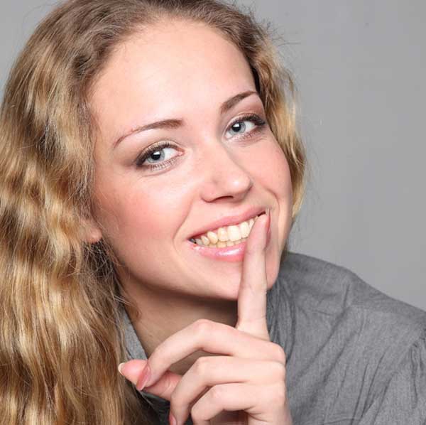 silence-woman-finger-face-smile-secret