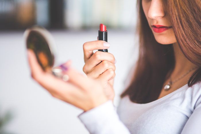 Woman-brown-hair-doing-lipstick-mirror-beauty-girl-makeup-cosmetics-lipstick