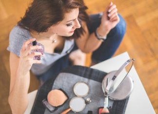 Perfume Trends for 2026: How Scent Is Becoming More Personal Than Ever Woman using a fragrance