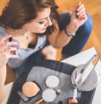 Perfume Trends for 2026: How Scent Is Becoming More Personal Than Ever Woman using a fragrance